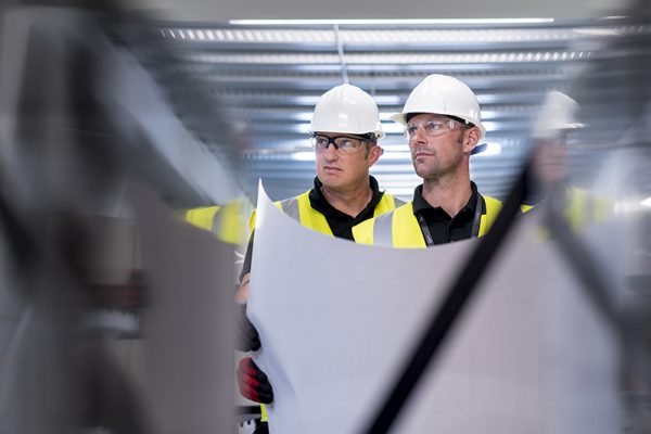 Men looking at plans